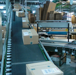 Carboard boxes traveling on conveyor with Clipper® Wire Hooks on conveyor